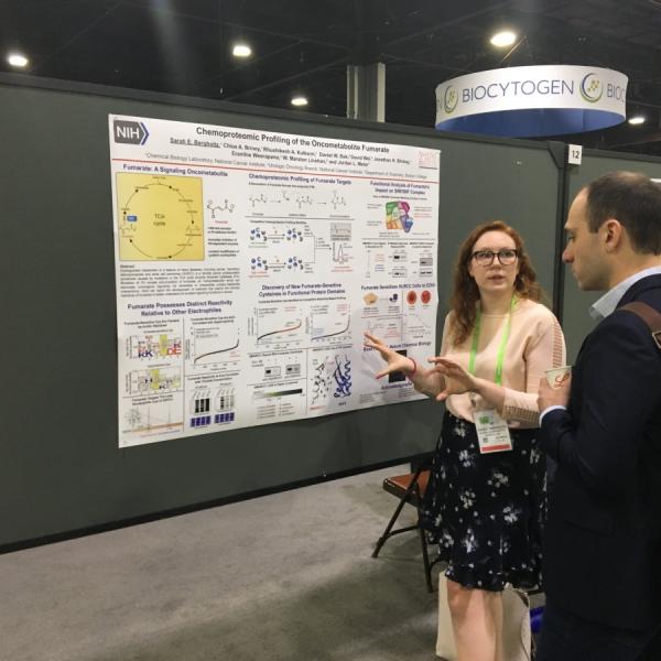 Sarah presenting her poster at AACR.