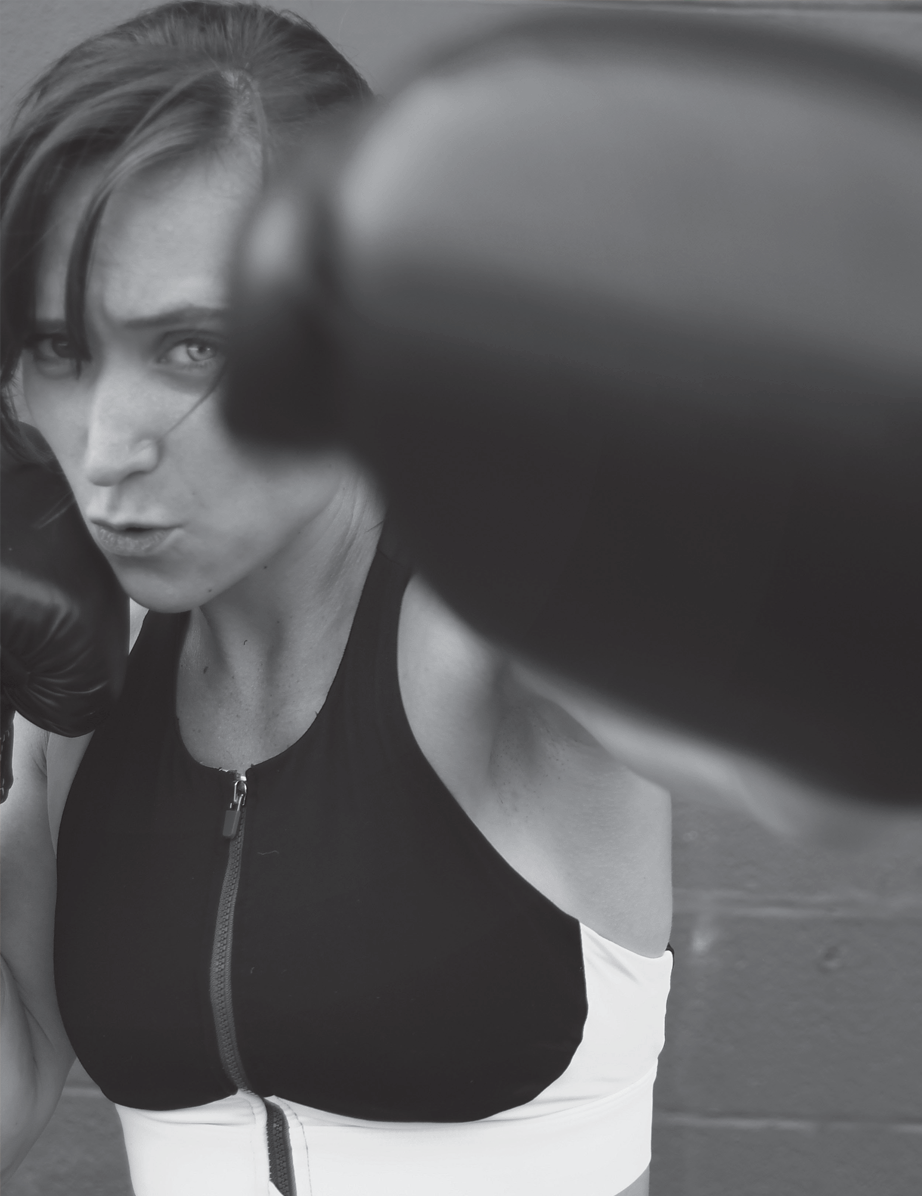 One-Two Punch for Cancer - Female boxer throwing a punch