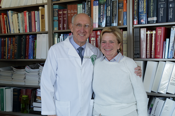 Dr. Steven A. Rosenberg with a patient at the NIH Clinical Center.