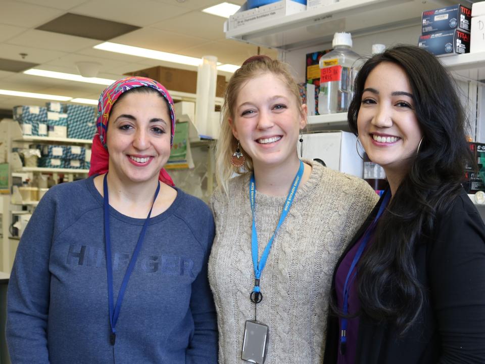 three CCR fellows in the lab