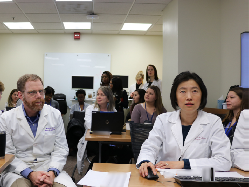Mark Gilbert and Jing Wu lead a clinical training session in the neuro-oncology branch