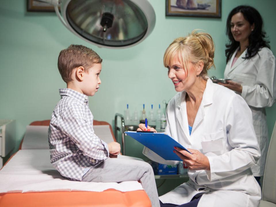 Doctor talking to a pediatric patient