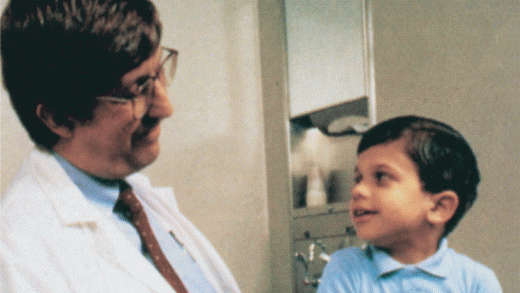 Dr. Francis Collins talking to a child with neurofibromatosis type 1