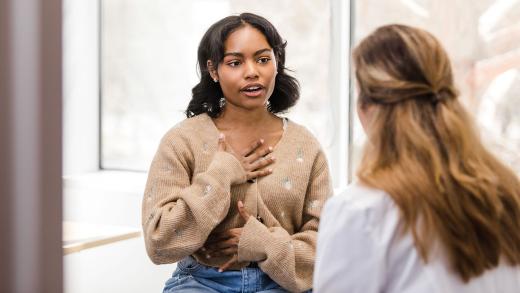 A teenage cancer patient talking to her doctor