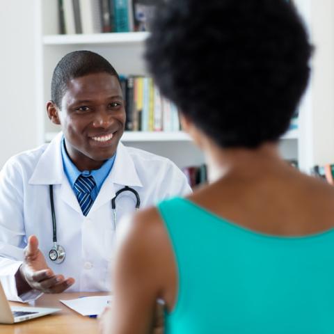 stock image of doctor with patient