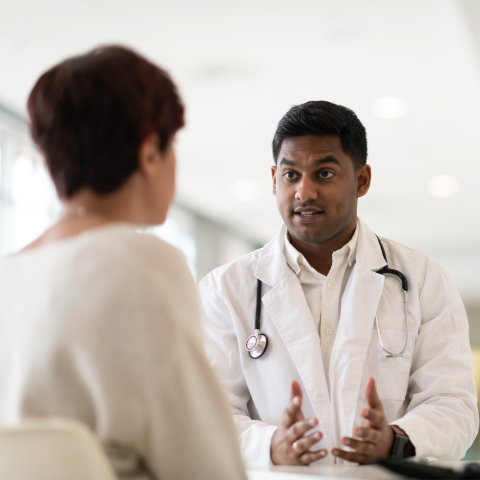 Male doctor with female patient