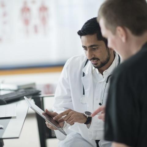 two doctors reviewing a patient's chart