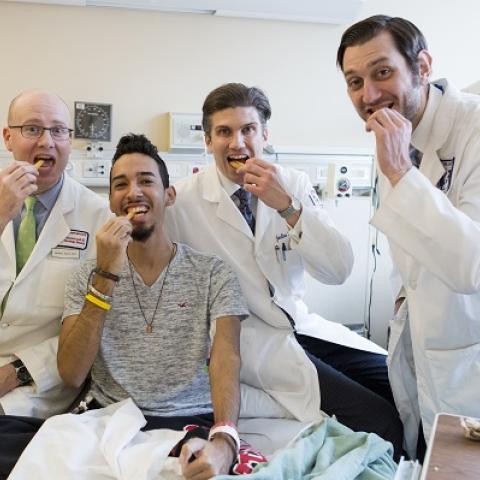 Jeremy Davis, Joel Rodriguez, Jonathan Hernandez and Adam Cerise celebrate Joel’s successful surgery with burgers and fries.