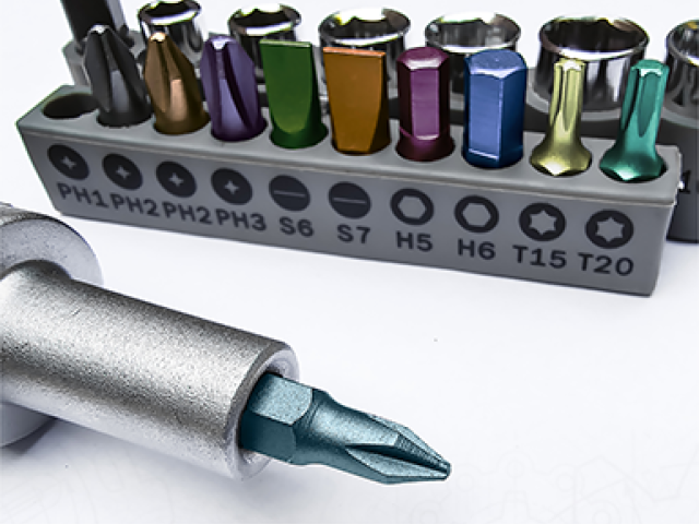 A screwdriver with a variety of screwdriver heads in different sizes and shapes.