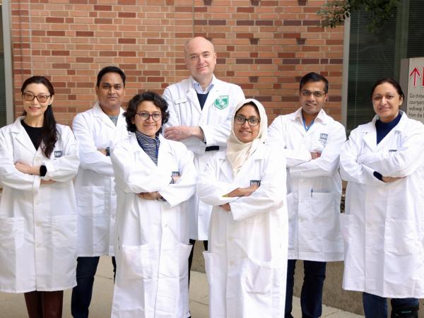 A group lab photo of Dr. Udo Rudloff's lab outside of the NIH Clinical Center.