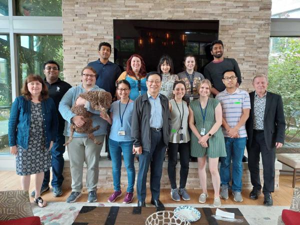 A group photo of Zhuang with lab members, NIH colleagues and other research collaborators. 