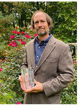 ​ Image ​ Image ​Eric O. Freed, Ph.D., holding 2020 Distinguished Research Career Award from The Ohio State University Center for Retrovirus Research​ 