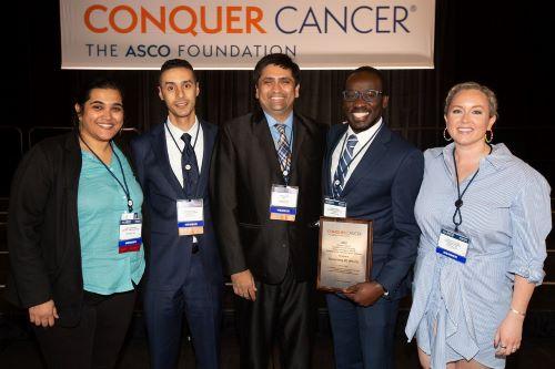 Faculty members Drs. Ramya Ramaswami and Kathyrn Lurain pose with three fellows they helped to mentor who each earned Young Investigator Awards from the American Society for Clinical Oncology