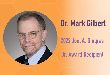 Headshot of Mark Gilbert with the words: "2022 Joel A. Gingras Jr. Award Recipient"