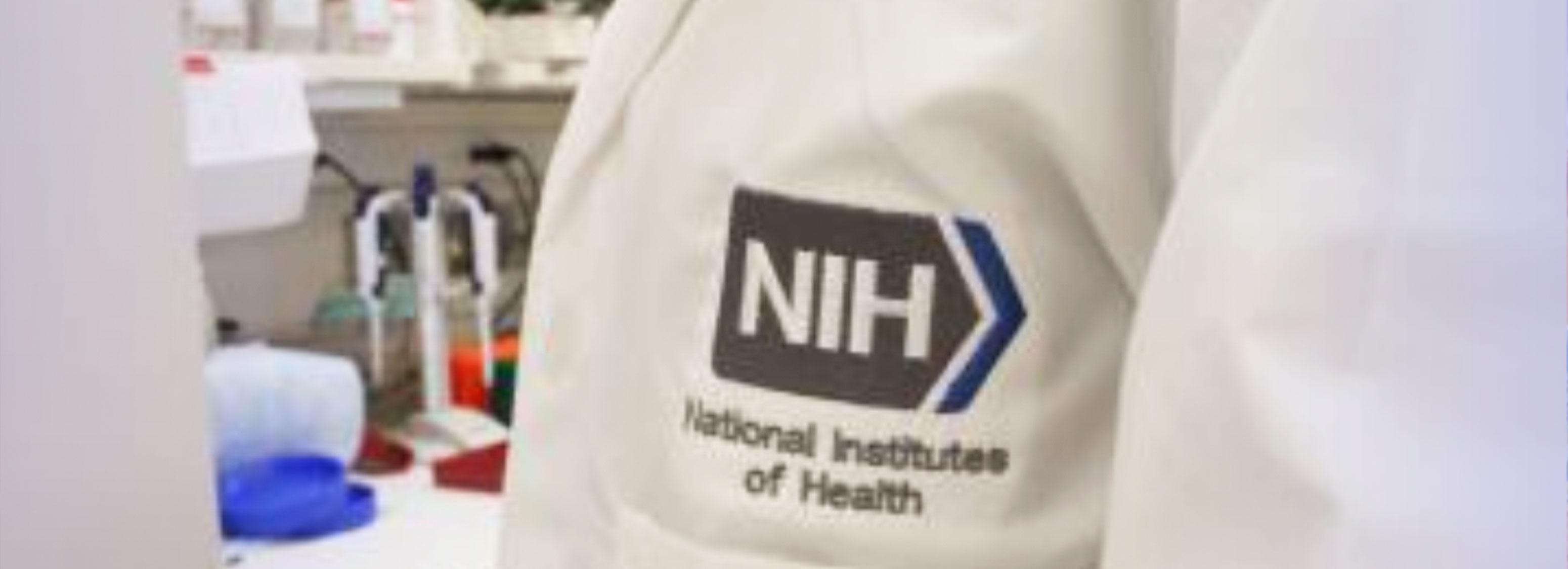 Close-up of labcoat with NIH logo