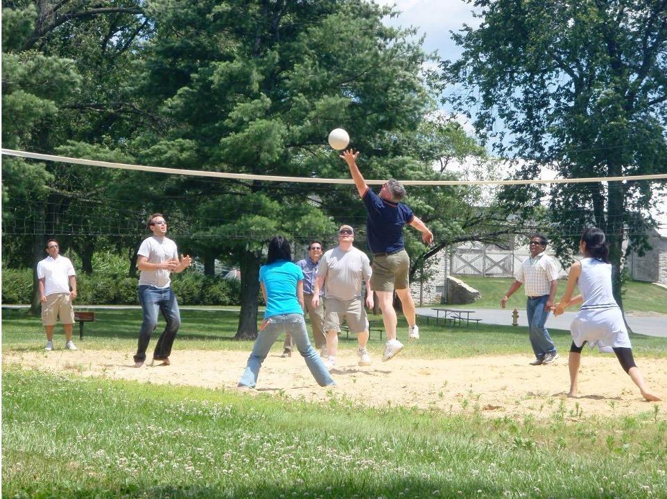 Dr. Byrd playing volleyball with his lab