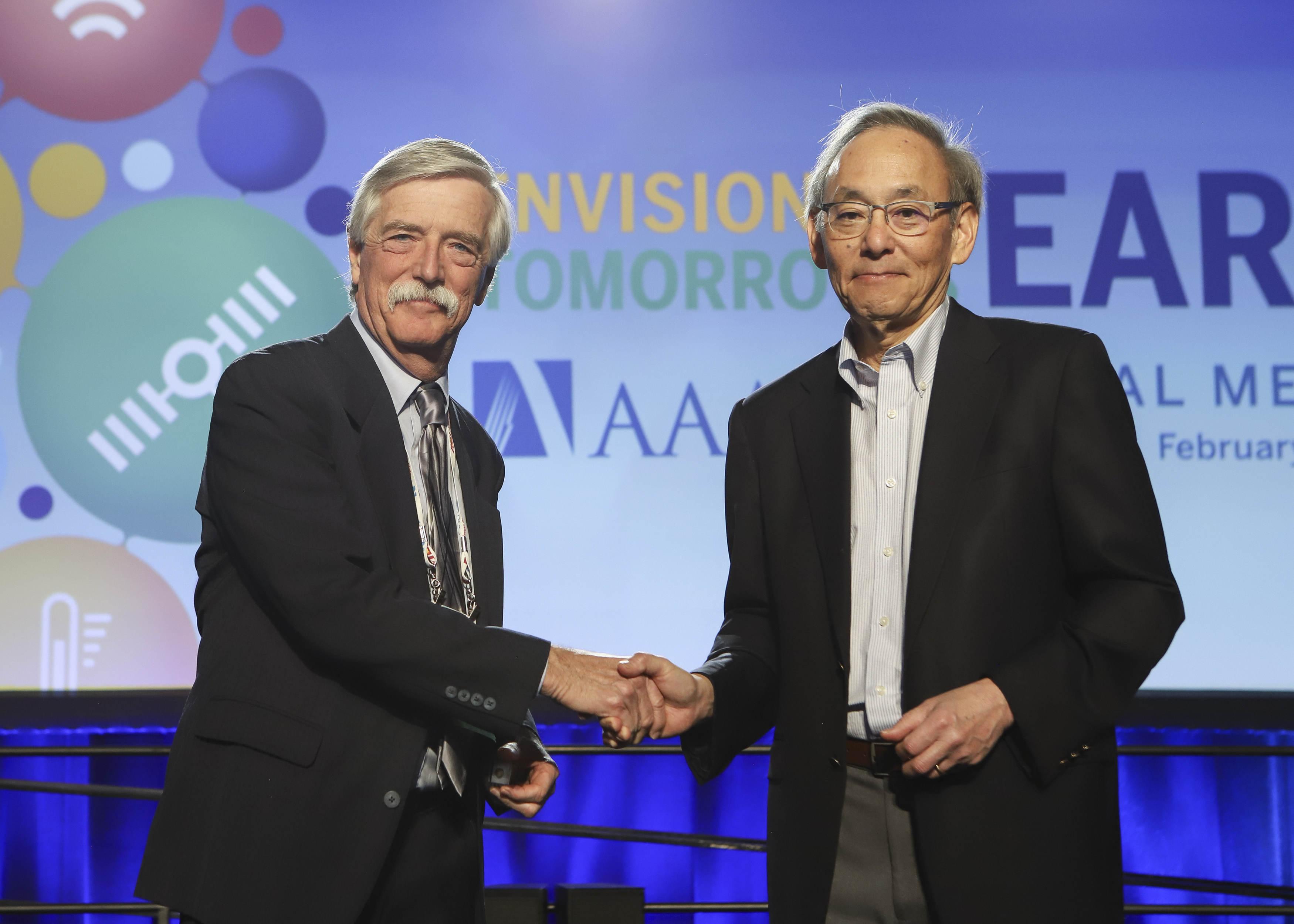 Shaking hands with Steve Chu at AAAS Fellows reception in Seattle, just pre-COVID.