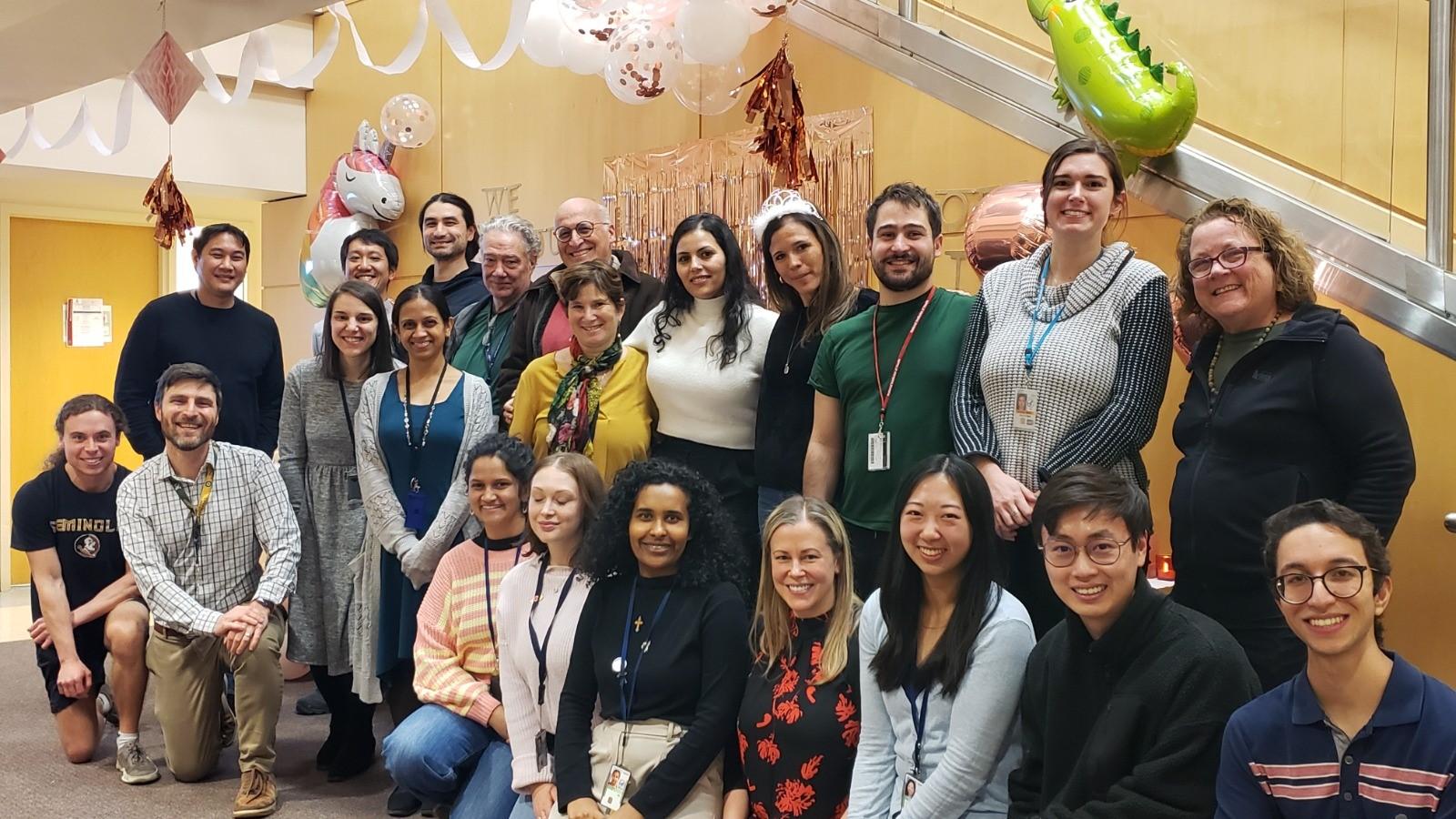 The group poses in the NIH clinical center