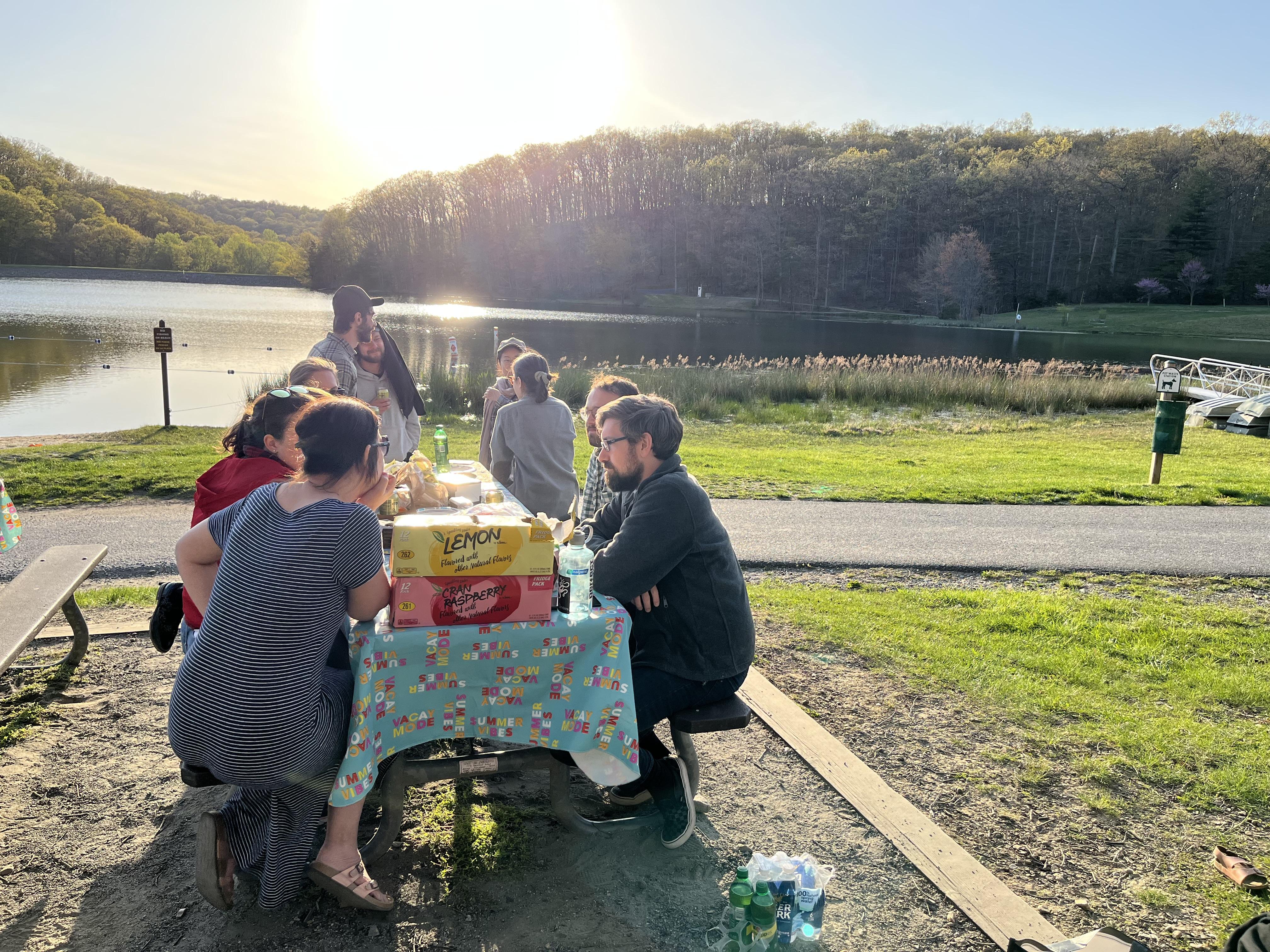 People sitting at a table in the park