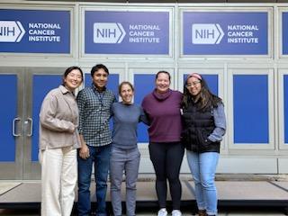 Lab members pose at a conference