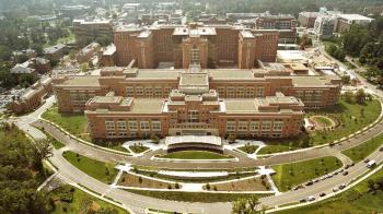 Aerial view of the NIH Campus with the iconic Building 10, which houses the NIH Clinical Center hospital, in the foreground. 