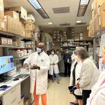 Dr. Troy McEachron explains his research to NCI Director Dr. Monica Bertagnolli on May 25th.