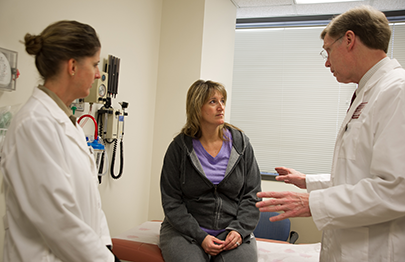 Dr Linehan, staff and a patient discuss options